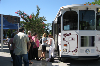 citizens boarding trolley car