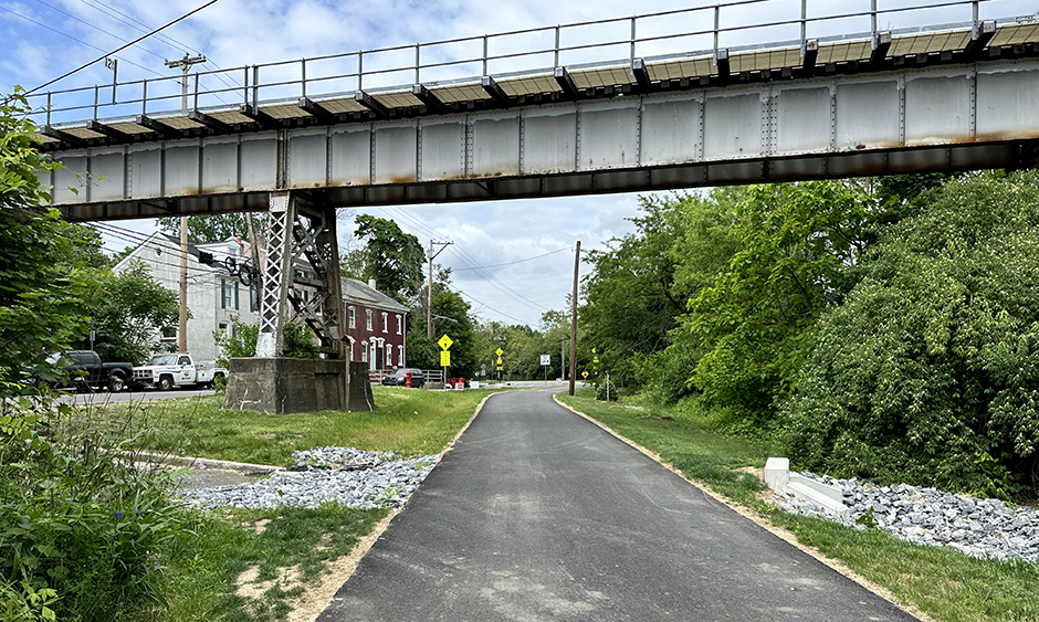 A multiuse trail passes underneath a bridge