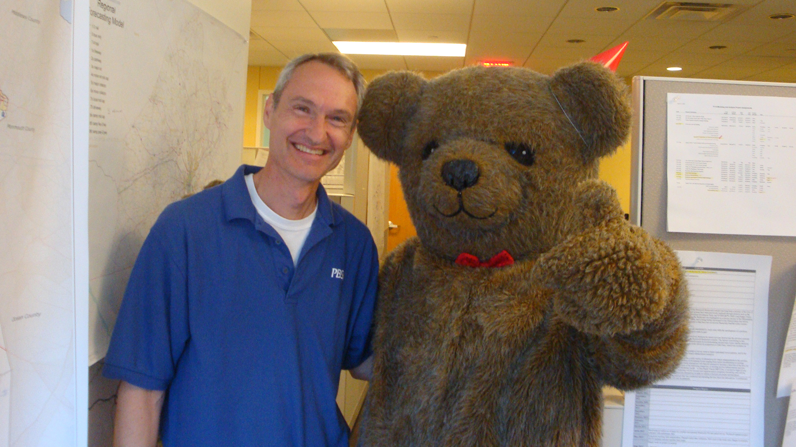 DVRPC's Brad Lane stands next to someone in a bear costume